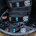 EQU STREAMZ cool boots being soaked in water bucket for cooling