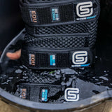 EQU STREAMZ cool boots being soaked in water bucket for cooling